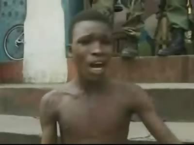 Boy Pleading with Army Guards is Shot to Death in the Back, another Man Executed by Machine Gun (Africa)