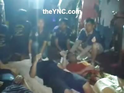 4 Men still as a Board on the Beach after a Capsized Boat Death by Drowning