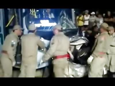 Car PANCAKED behind a Bus with a Man inside of It......