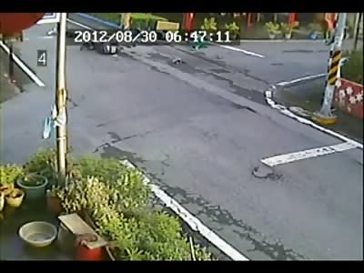 2 Scooters at an Intersection in China....