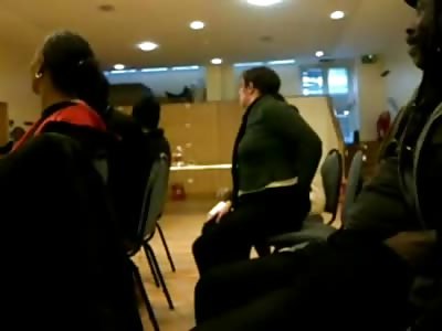 Woman Sticking her Hand down her Pants and Smelling them at a Town Hall Meeting....