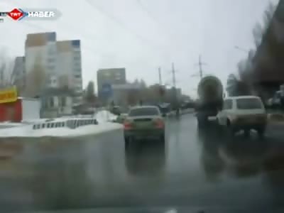 Complete Idiot tries to Lay Underneath Giant Truck but Fails