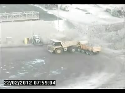 Careless Moron Backs up into Co-Workers Truck Nearly Decapitating Him