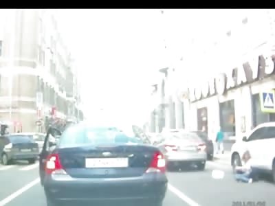 Female Pedestrian Crossing Road is Hit by Maneuvering Car