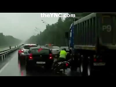 Famous Photographer is Killed Instantly when his Motorcycle Slips under Truck and He's Crushed by the Wheel