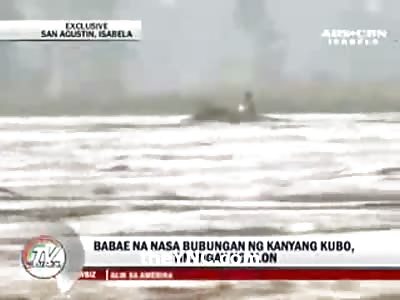 Woman Dances on top of Flooded House Before She's Swept away to Her Death