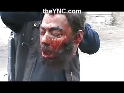 Short video of Terrorist showing Off Trophy of a Human Head 