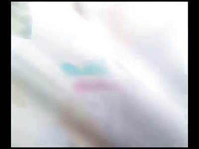 Large Crowd Gawks at Scooter Rider who is Crushed to Death in between 2 Trucks still Upright 