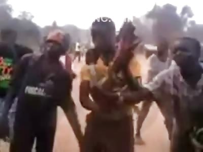 Cannibal Eating the Leg of the Man he Just Killed While his Boys Cheer Him on