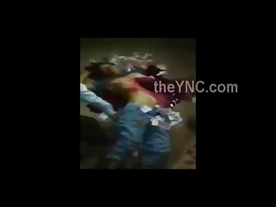 In a Bizarre Ritual People Throw Money at the Dead body of a Man Just Blown up by Fireworks