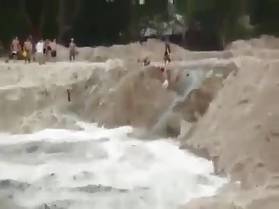 This can be considered a hero....Kids Trying to Save Each Other All Get Swept Away in a Bad Powerful Flood (No Info is They Survived) 