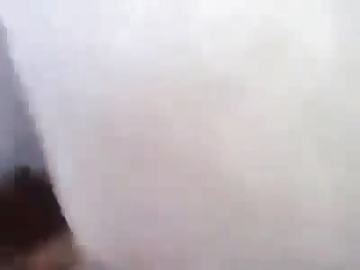 Iraqi Soldiers Kick and Stomp the Head of a Dead Bloodied Terrorist 