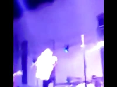 Mexican singer Alfredito Olivas shot on stage