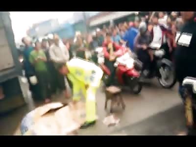 Remains of a Crushed Woman Scooped Up