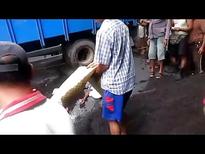 Police Try to Keep the Rowdy Crowd at Bay From Seeing the Dead Dude