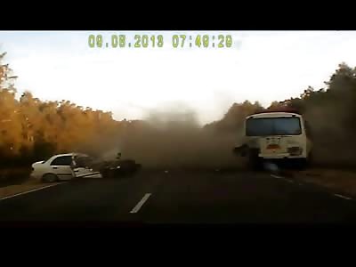 Car Crashes into Parked Bus