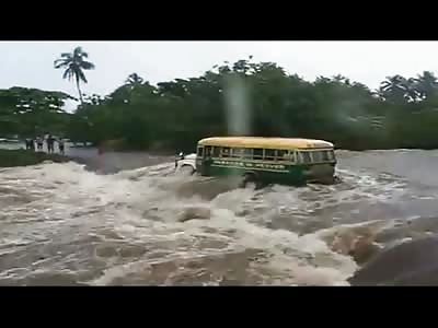 Bus Overturned by Raging River Water Killing Two Female Passengers