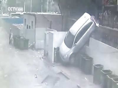 CAR NOSEDIVES AFTER CRASHING INTO GUARDRAIL