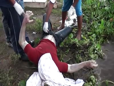 BANK ROBBER SUSPECT IS FOUND FLOATING IN THE RIVER