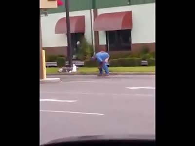 Just a guy defecating on the side of the parking lot