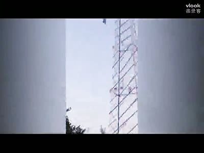 Naked woman on power line tower falls after being hit by electric shock 