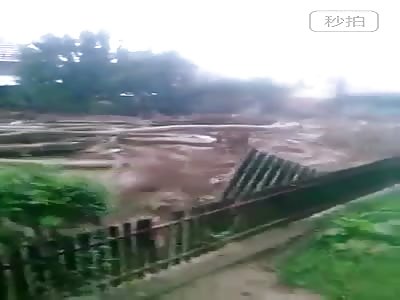  Flood sweeps street in town