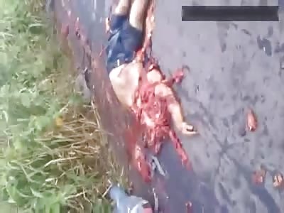 Terrible head-on collision aftermath - woman lie dead on the ground next to completely crushed man 