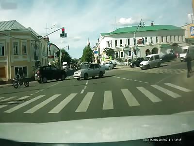 Biker Lands on Car Roof After Crash