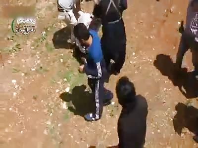 Citizens of Homs watch the execution of the notorious killer Ghazwan Nabhan Abu Muhsen  