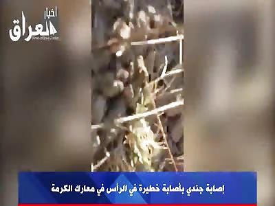 Iraqi soldier Agonizing after a head shot.. He will die!